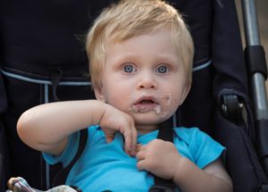 Baby with crumbs on face