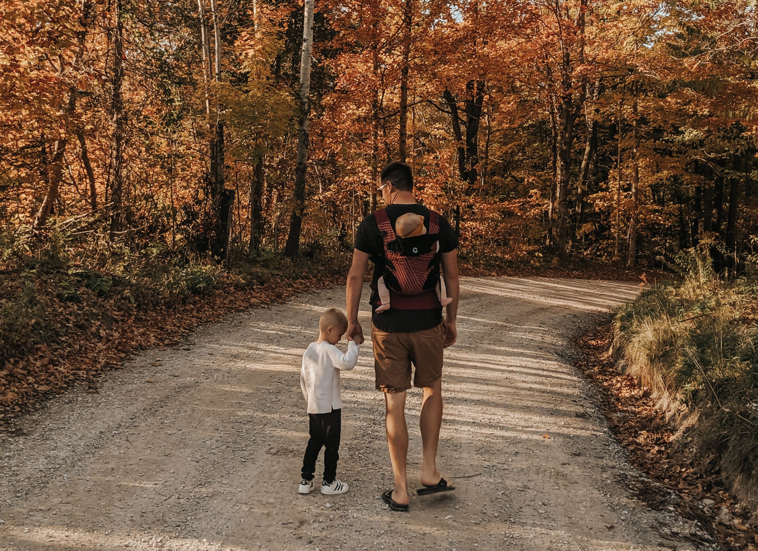 Dad, boy and baby in Contours Carrier