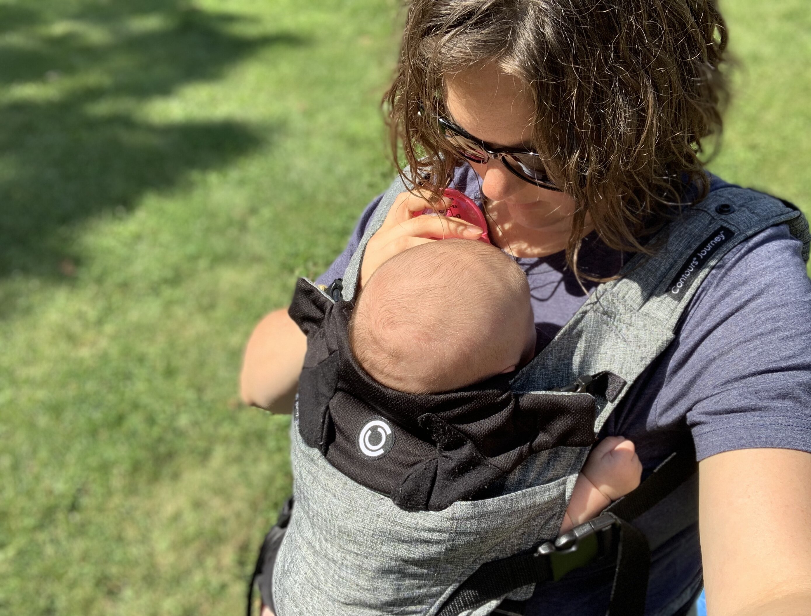 Mom Breastfeeding Baby in Contours Baby Carrier