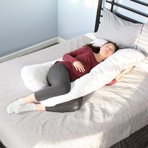Mom-to-be sleeping with the Contours pregnancy pillow