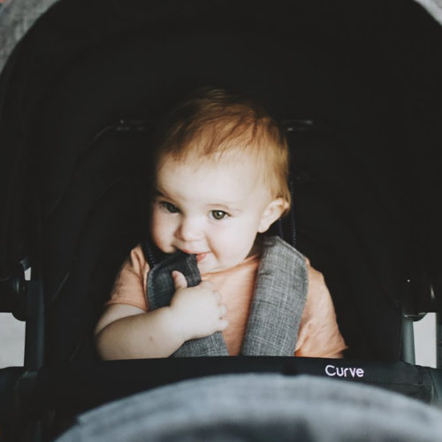 Baby in Curve stroller close up_IG