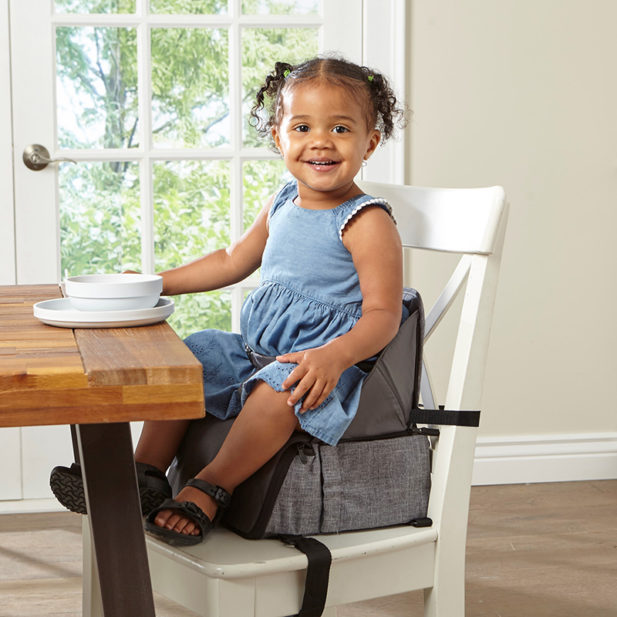 Toddler sitting on Contours Booster Seat