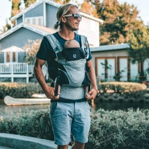 dad waring baby in Journey carrier